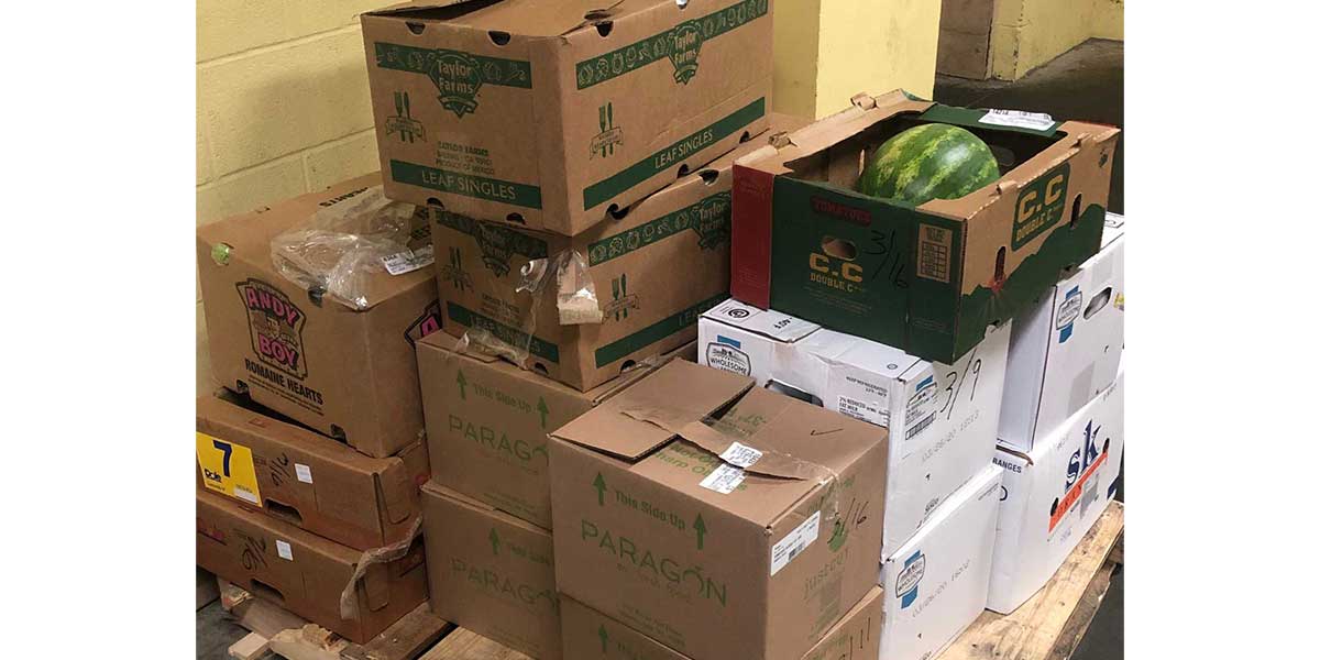 Hundreds of pounds of food packed up by the Wheeling team to be donated to the community