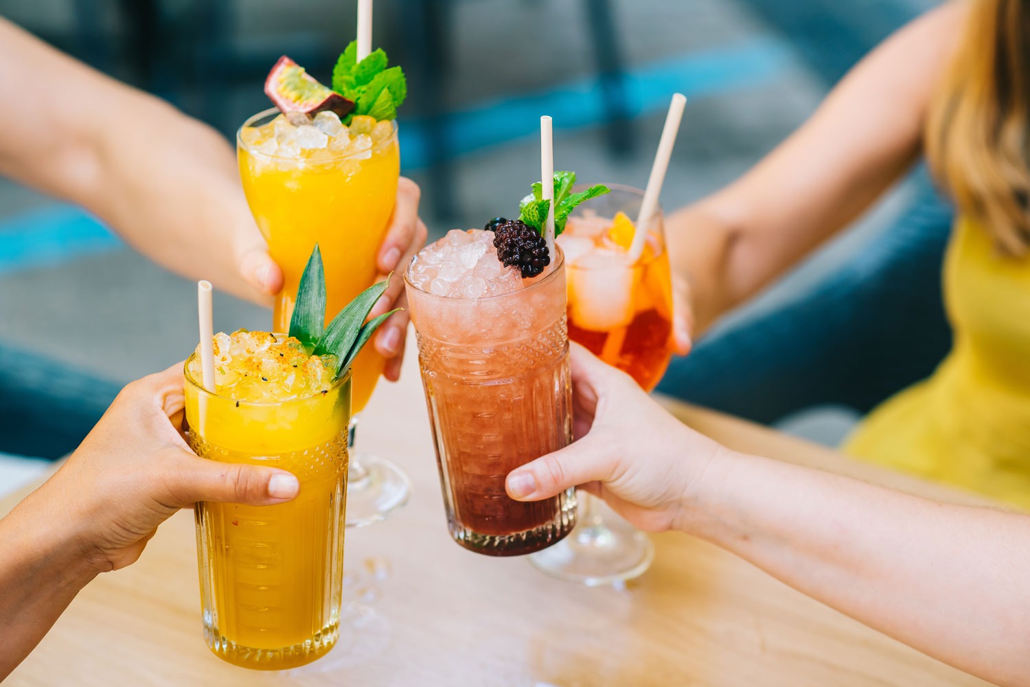 Castaways Bar - Group of ladies with varying cocktails taking a moment to cheers the moment