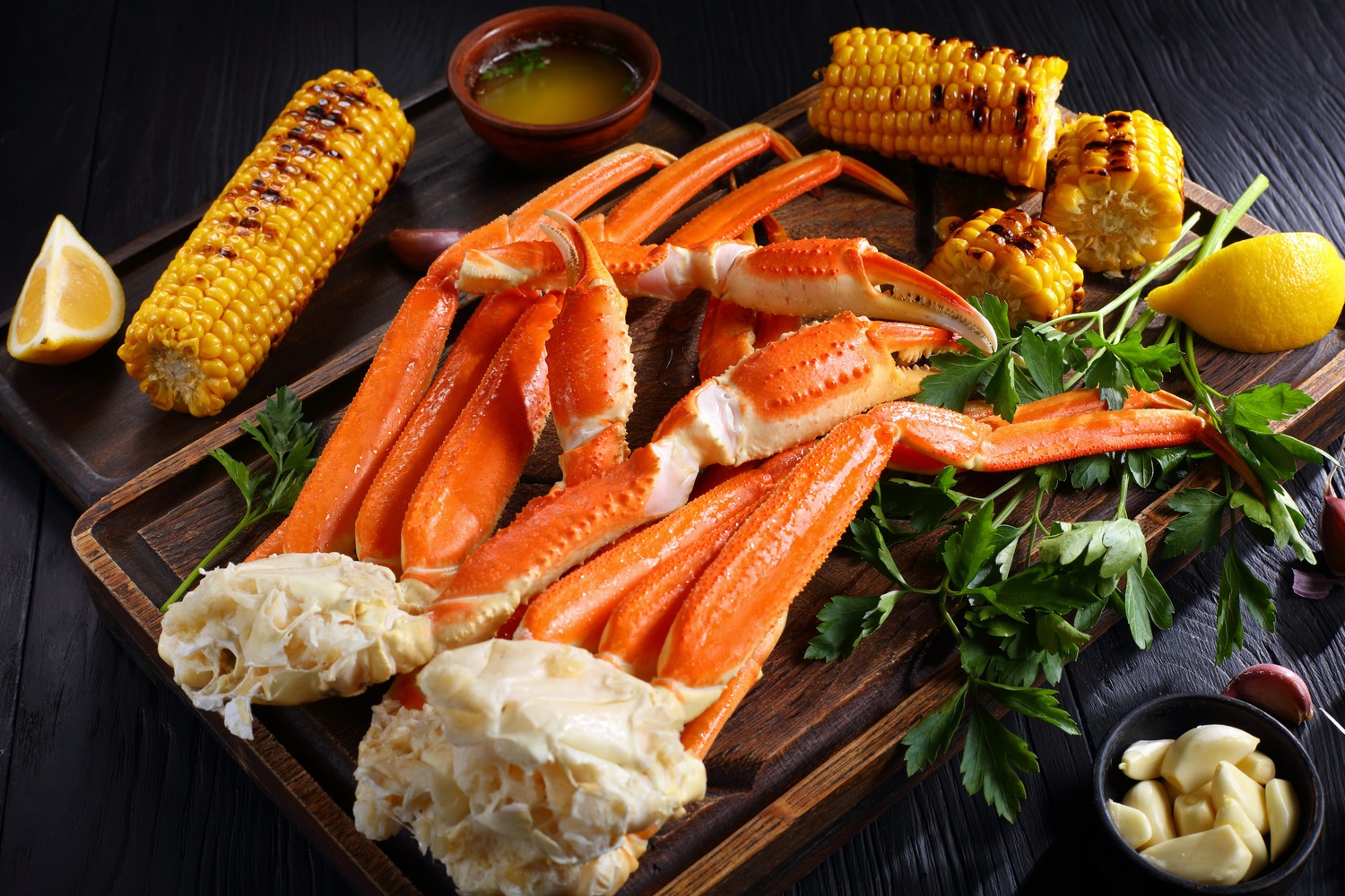 The Buffet - Seafood board with crab legs and corn